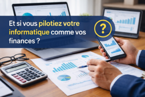 Dirigeant consultant des tableaux de bord financiers et informatiques sur ordinateur et smartphone pour piloter son entreprise avec des indicateurs clairs.