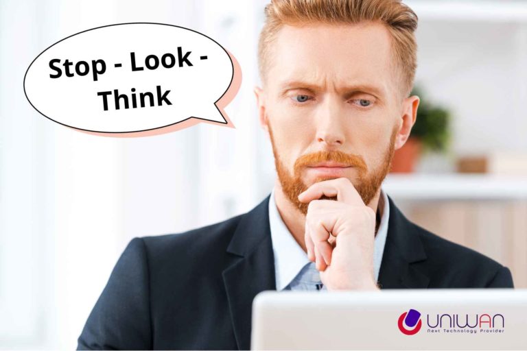 Dirigeant de PME réfléchissant avant de cliquer, avec le message STOP LOOK THINK pour illustrer les bons réflexes en cybersécurité.
